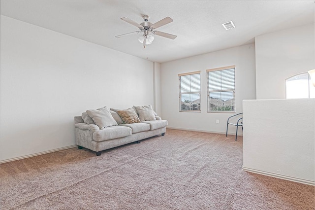 1506 San Miguel Ct, Midland, TX 79705 - living room with a ceiling fan, healthy amount of natural light, and light colored carpet
