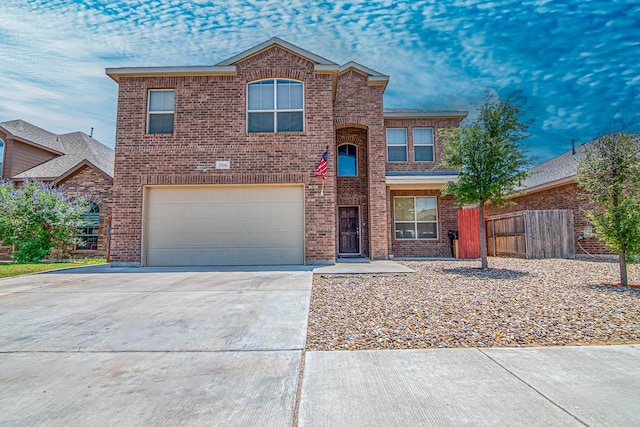 1506 San Miguel Ct, Midland, TX 79705 - traditional-style home featuring an attached garage, brick siding, and driveway
