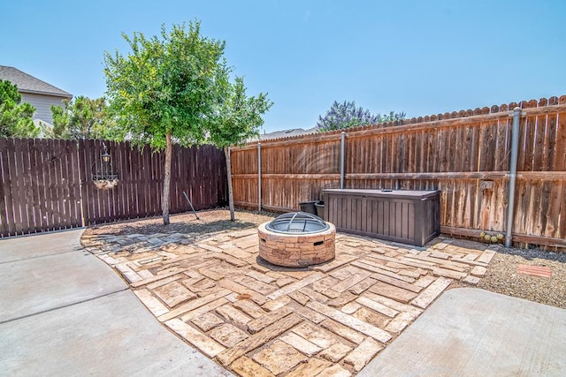1506 San Miguel Ct, Midland, TX 79705 - fenced backyard with an outdoor fire pit and a patio