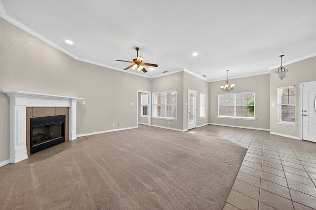 29 Vista Crest Ct, Odessa, TX 79762 - unfurnished living room featuring crown molding, a tiled fireplace, a ceiling fan, recessed lighting, and a chandelier