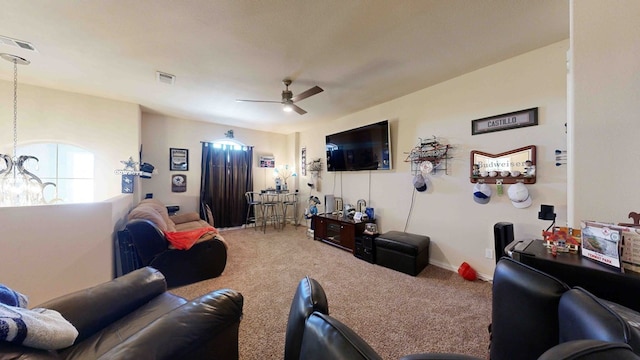 living room featuring ceiling fan and carpet floors