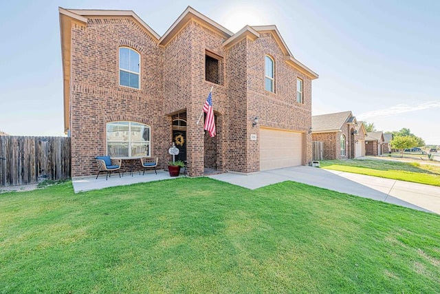 view of front of house featuring a front yard and a garage