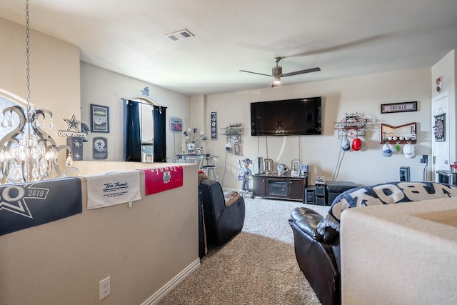 carpeted living room with ceiling fan