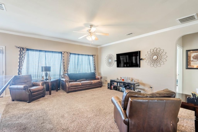 living room featuring carpet floors, ceiling fan, and crown molding