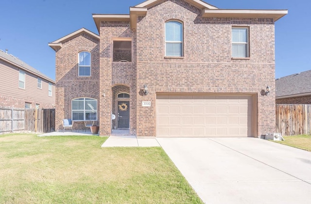 view of front of home featuring a garage and a front lawn