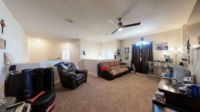 carpeted living room with ceiling fan