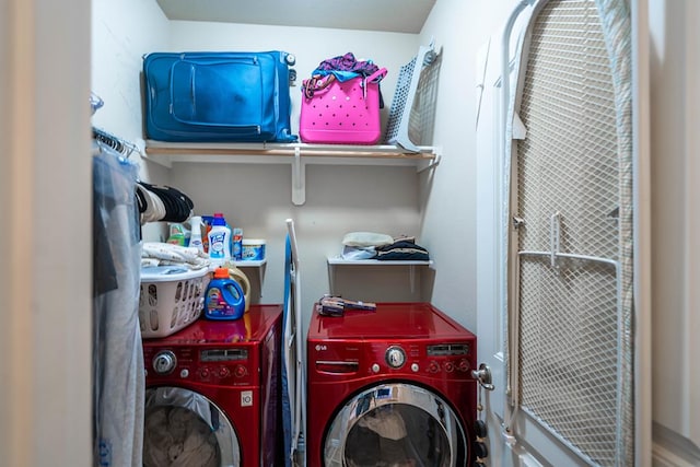 clothes washing area featuring separate washer and dryer