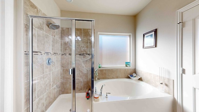 bathroom featuring plus walk in shower