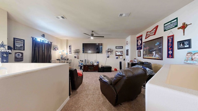 living room featuring carpet and ceiling fan