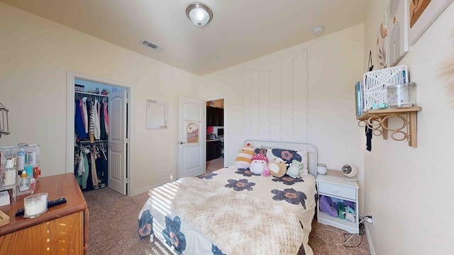 carpeted bedroom with a closet