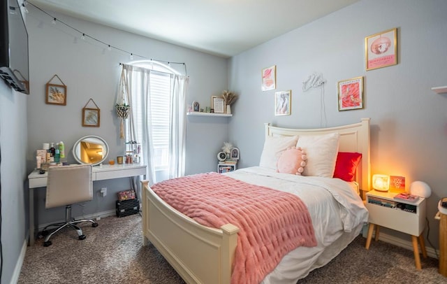 bedroom featuring dark colored carpet