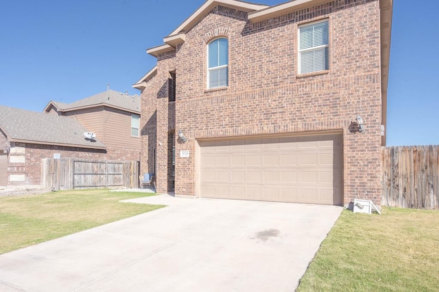 view of front of house with a front lawn and a garage