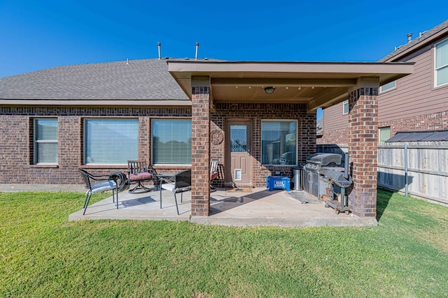 back of property featuring a yard and a patio area