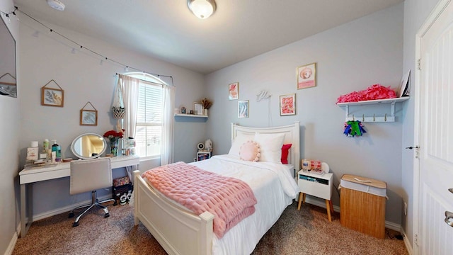 bedroom featuring dark colored carpet