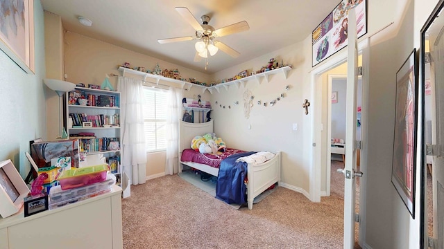 bedroom featuring light carpet and ceiling fan