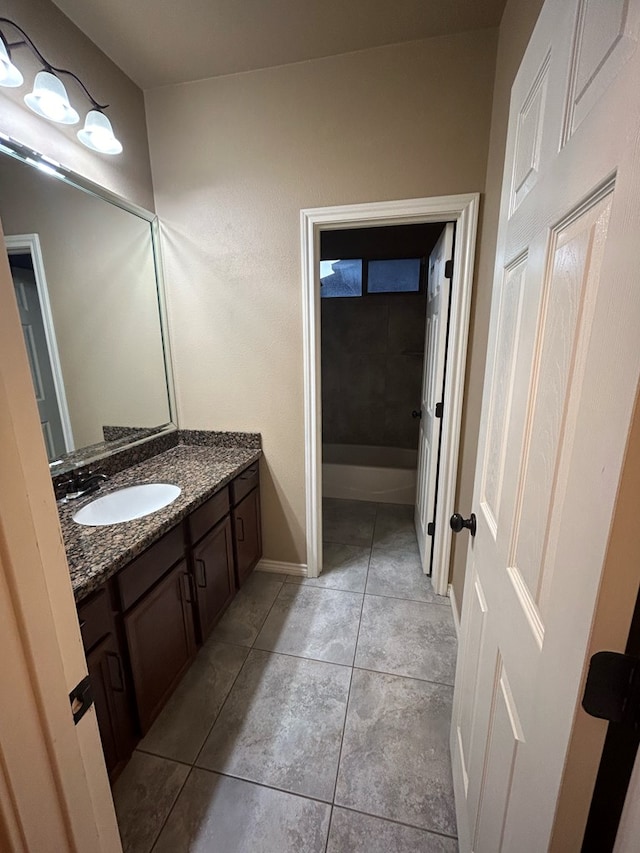 bathroom with tile patterned flooring and vanity