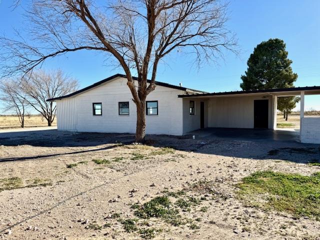 view of front of home with a carport