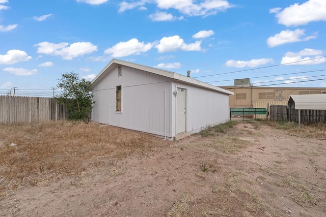 view of outdoor structure featuring fence