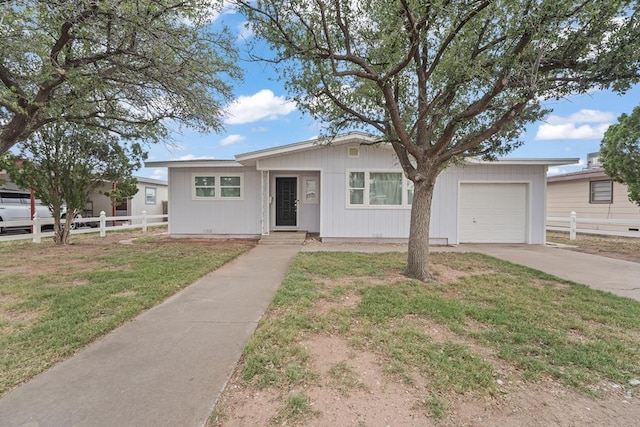 view of front of house featuring an attached garage and driveway