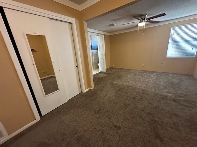 902 W 39th St, Odessa, TX 79764 - unfurnished room featuring dark colored carpet, ceiling fan, and crown molding