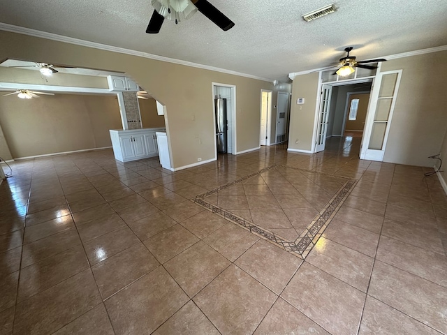 902 W 39th St, Odessa, TX 79764 - tiled spare room featuring a ceiling fan, ornamental molding, and a textured ceiling