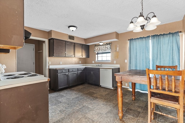 kitchen featuring visible vents, decorative light fixtures, white dishwasher, light countertops, and dark brown cabinets