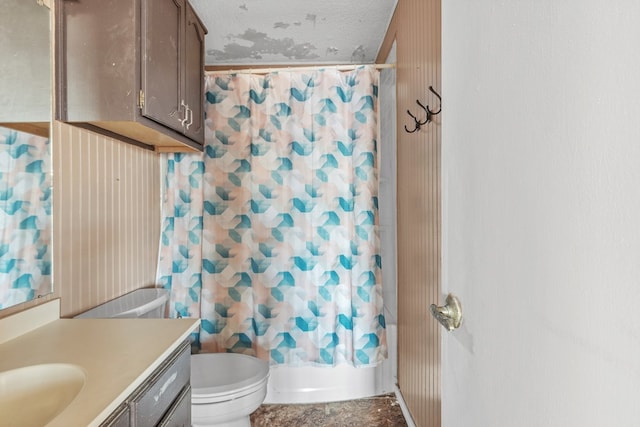 bathroom with toilet, shower / bathtub combination with curtain, and vanity