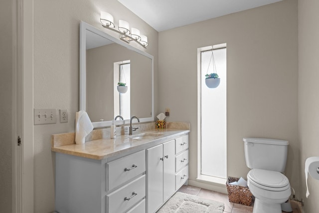 9408 Cromwell Ter, Odessa, TX 79764 - bathroom with vanity, toilet, and tile patterned flooring