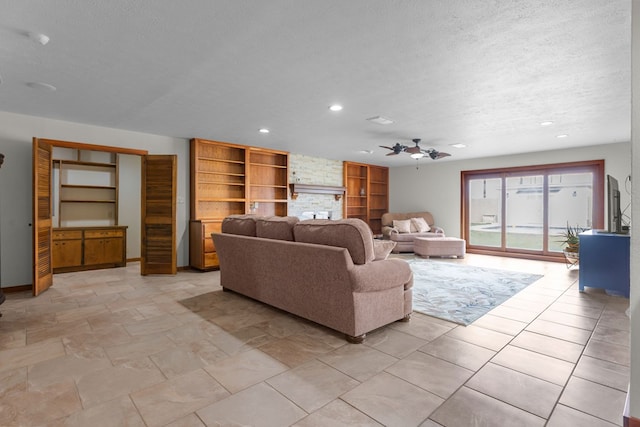 9408 Cromwell Ter, Odessa, TX 79764 - living room featuring baseboards, recessed lighting, ceiling fan, and a textured ceiling