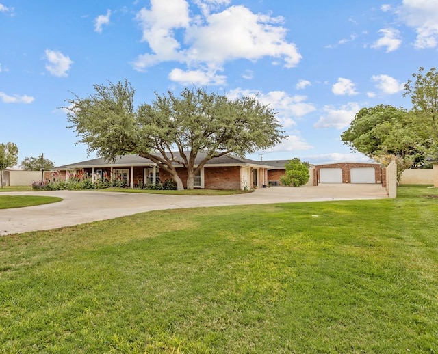 9408 Cromwell Ter, Odessa, TX 79764 - ranch-style house with concrete driveway, brick siding, a front lawn, and a garage