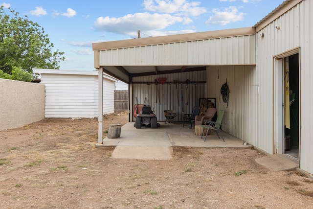 9408 Cromwell Ter, Odessa, TX 79764 - view of patio featuring an outdoor structure and fence
