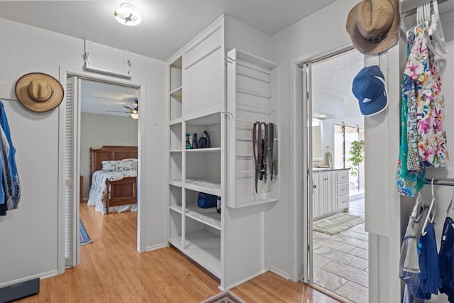 9408 Cromwell Ter, Odessa, TX 79764 - walk in closet featuring ceiling fan and light wood-type flooring