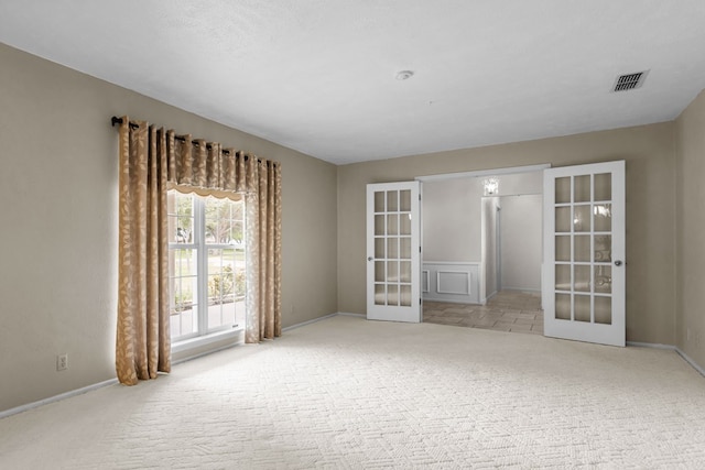9408 Cromwell Ter, Odessa, TX 79764 - carpeted spare room featuring baseboards, french doors, and visible vents