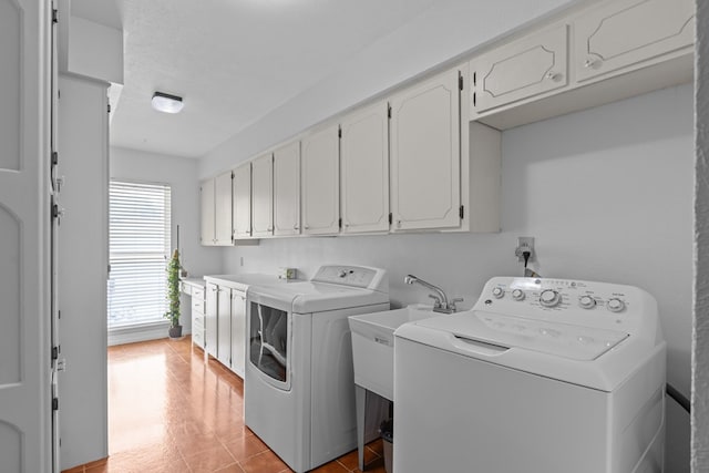 9408 Cromwell Ter, Odessa, TX 79764 - clothes washing area featuring a sink, separate washer and dryer, and cabinet space