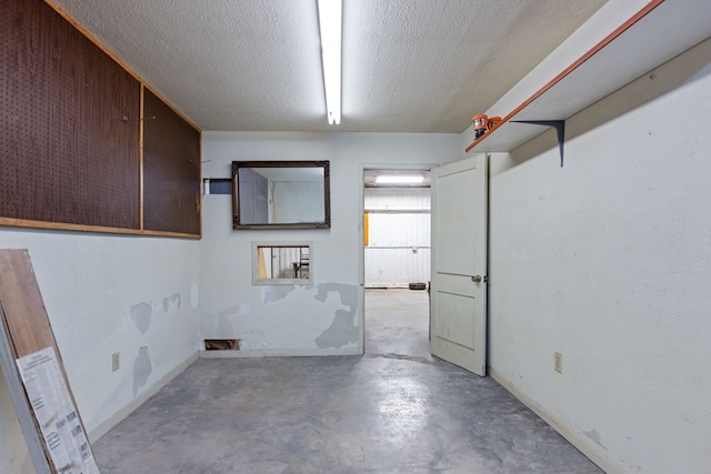 9408 Cromwell Ter, Odessa, TX 79764 - interior space featuring a textured ceiling and concrete flooring