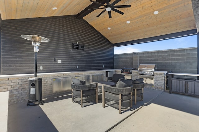 view of patio featuring area for grilling, ceiling fan, and grilling area