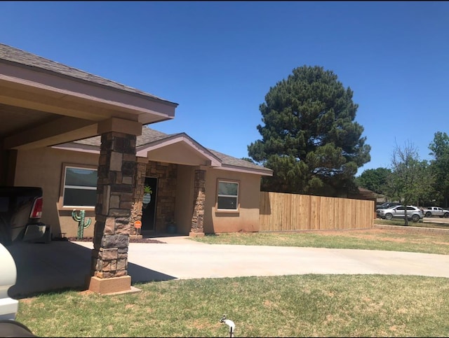 view of exterior entry with stone siding and stucco siding