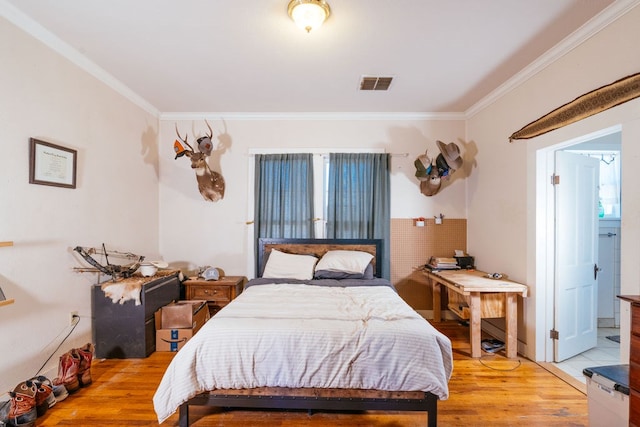 603 N 11th St, Alpine, TX 79830 - bedroom featuring ornamental molding, light wood finished floors, and ensuite bath