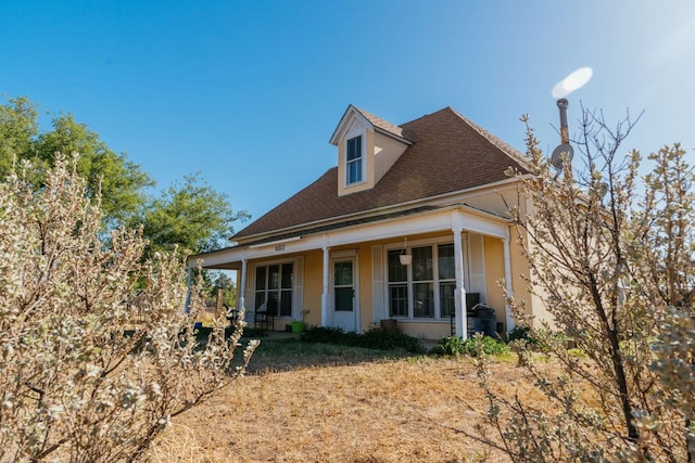 603 N 11th St, Alpine, TX 79830 - view of front of home with covered porch and a shingled roof