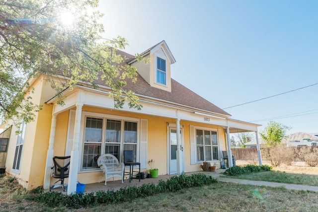 603 N 11th St, Alpine, TX 79830 - view of front of home featuring a porch, a shingled roof, and stucco siding