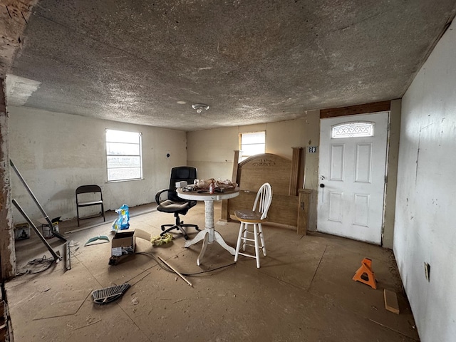 interior space featuring a textured ceiling