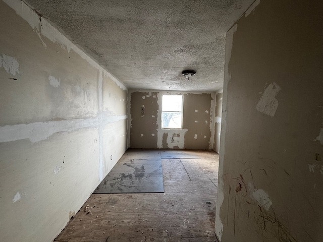 empty room featuring a textured ceiling