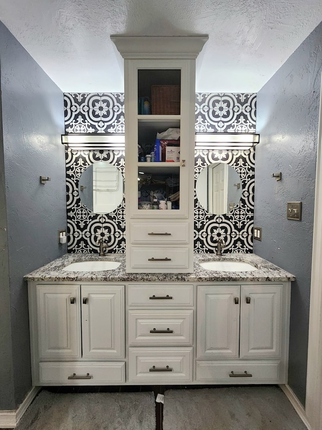 bar featuring a sink, baseboards, and carpet flooring