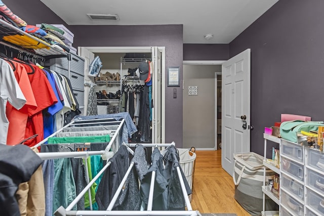 1306 Douglas Dr, Odessa, TX 79762 - walk in closet featuring wood finished floors