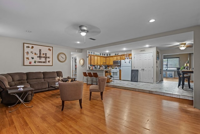 1306 Douglas Dr, Odessa, TX 79762 - living area with ceiling fan, light wood-type flooring, and recessed lighting