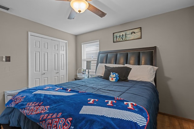 1306 Douglas Dr, Odessa, TX 79762 - bedroom featuring a closet, wood finished floors, a ceiling fan, and baseboards