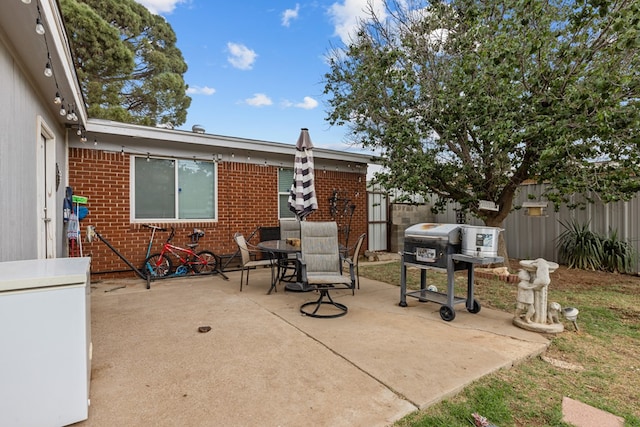 1306 Douglas Dr, Odessa, TX 79762 - view of patio with fence and outdoor dining area