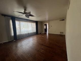 unfurnished living room featuring ceiling fan and wood finished floors