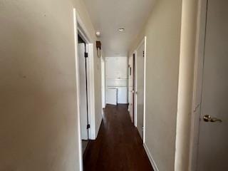 hallway featuring baseboards, recessed lighting, and dark wood-style floors