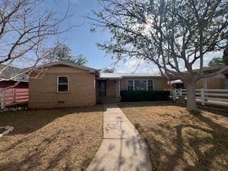 single story home featuring fence